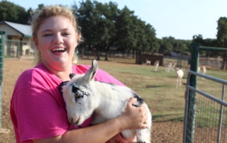 Guliana Biasetto holding a goat.